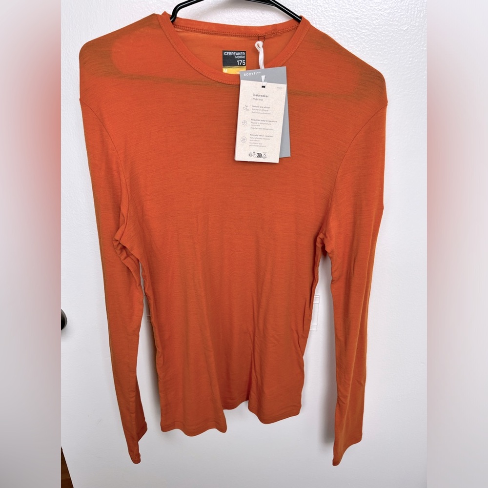 Brand new orange Icebreaker made of wool